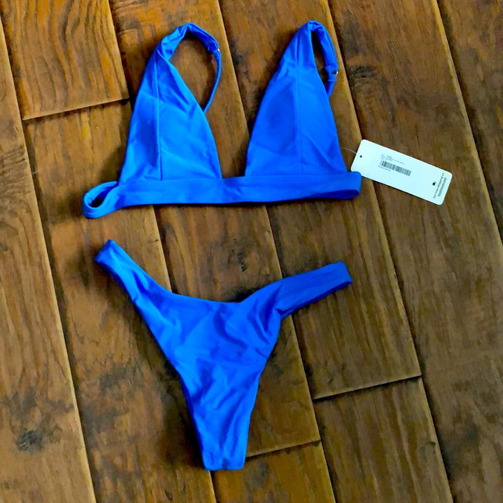 Brand new. Medium size. Rich blue bikini. Blushmark brand